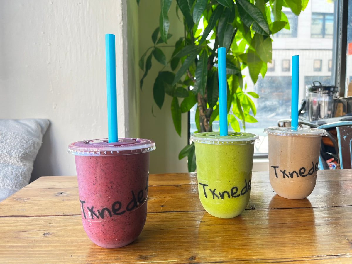 Three Txnedef smoothies on a table