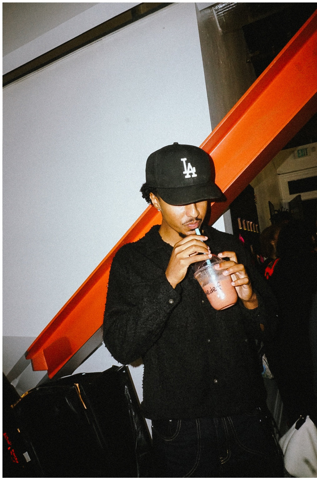 A guest sipping a smoothie at Txnedef’s second anniversary